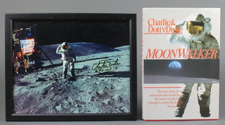 Charlie Duke (astronaut Apollo 16), a signed coloured photograph of the moon landing 8" x 10" together with 1 volume Charlie and Dottie Duke "Moonwalker", signed