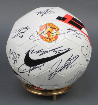Manchester United, a signed football, signatures include Wayne Rooney 