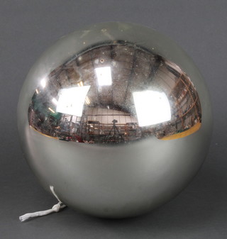 A circular silver Witches ball 11" 