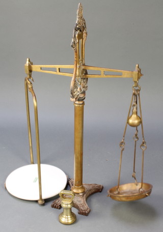 A pair of 19th Century W & T Avery brass and iron scales together with a 4lb bell weight 