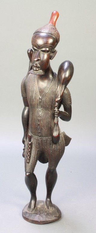 An African carved hardwood figure of a standing huntsman 42" 