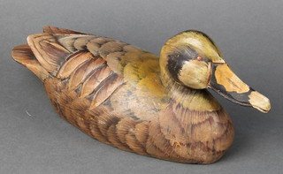 A reproduction carved and   painted wooden decoy duck 13" 