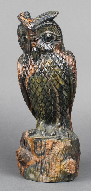 A carved hardstone figure of an owl on a tree trunk 11" x 4" 