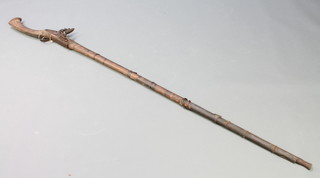 A 19th Century flintlock native jezail with 56" barrel 