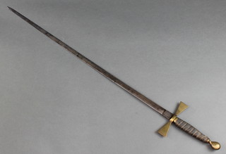 A 19th Century Knights Templar sword with brass cross bar marked presented to Sir KM E W ?? having a 31" blade 