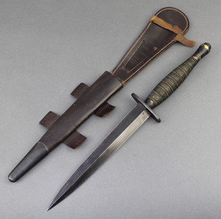 A Fairbairn Sykes fighting dagger with 7" blade, the pommel marked FR69 IFR69, the frog marked FR271, complete with leather scabbard, acquired by the vendor whilst serving in Cyprus 