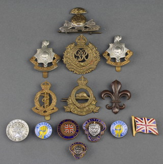 A George VI Royal Canadian Army Pay Corps cap badge, ditto Royal Engineers, a St John's Fusiliers cap badge, 2 silver and enamel Magister lapel badges, 2 Royal Sussex Regt. cap badges and 7 other badges 
