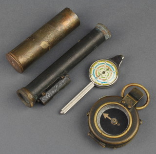 A First World War prismatic compass the base marked F-L no. 196892 1917, a brass "cannon" shell, a metal and brass gun sight 5" 