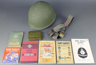 An American steel helmet complete with liner, 3 webbing belts, an American Army issue Italian phrase book September 1943, 2 pamphlets Navy Army RAF badges and a small quantity of ephemera 