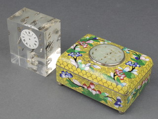 A Chinese yellow ground and floral patterned cloisonne enamel jar, box and cover decorated a pierced green hardstone panel raised on bun feet 2" x 4" x 3" together with a perspex paperweight in the form of an exploded wristwatch 3" x 2 1/2" x 1" 

