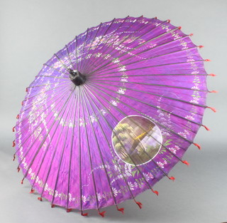 A Bassein parasol with bamboo shaft 