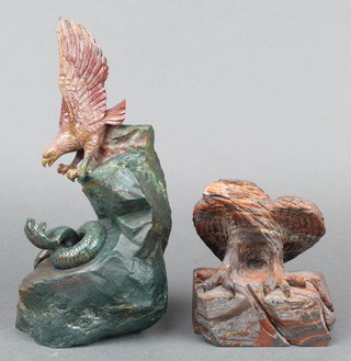 A carved soap stone figure group of an eagle with snake 9"h and a carved hardstone figure of a an eagle with wings outstretched 6" x 5" 