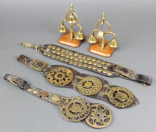 2 brass heavy horse swingers hung bells, 2 brass martingales hung horse brasses and a brass studded strap 