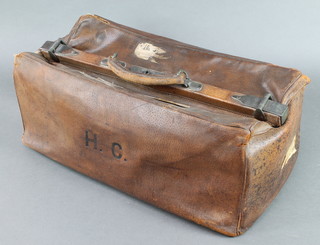 Pew & Company, a leather Gladstone bag with 5 Southern Railways labels (some damage) containing 3 red plastic Riv-Robe coat hangers 8 1/2"h x 22"w x 9 1/2"d 