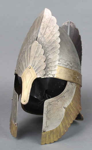 A replica polished metal and brass helmet 16" 