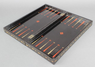 A black lacquered folding chess/backgammon board 
