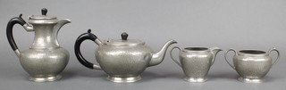 An Art Deco My Lady 4 piece circular planished pewter tea service comprising teapot (dent to base), hotwater jug (dent to base and lid), twin handled sugar bowl and cream jug 