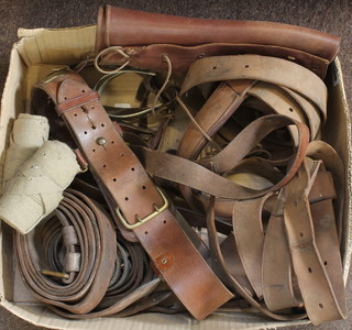 A pair of leather gaiters, a Sam Browne belt, a pair of spurs and a collection of leather straps