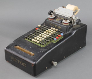 A Victor adding machine complete with instructions and 3 spools 