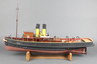 A Woodrise wooden model of Rescue Tug  HMS Cartmel,  raised on a wooden stand 30" x 20" 
