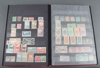 A red album of early French Colonial mint and used stamps 