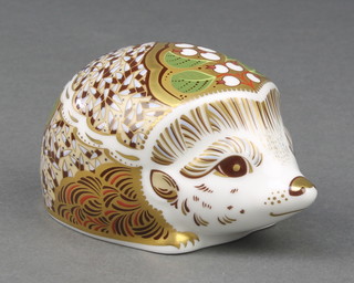 A Royal Crown Derby Imari pattern paperweight in the form of a hedgehog with gold stopper 3 3/4" 