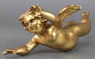 A carved gilt painted figure of a cherub 10" 