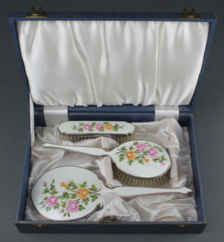A cased 3 piece (ex 4) silver plated guilloche enamel brush set 