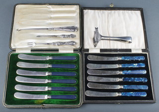 An Edwardian silver button hook, 1 other implement, a fork, a pair of sardine servers and 2 cased plated sets 