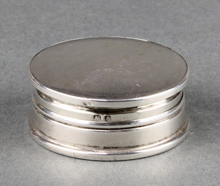 A circular silver compact with mirrored interior Birmingham 1925 1 1/4" 