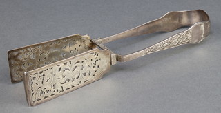 A pair of William IV cast and pierced silver asparagus tongs, London 1834