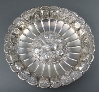 A Continental repousse silver bowl with vinous rim enclosing a bird amongst grapes and vines 610 grams 12" 
