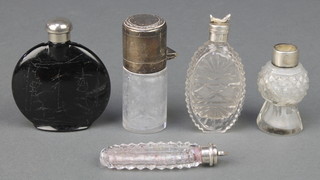 An Edwardian silver scent bottle with rubbed date letter, 4 other mounted bottles 
