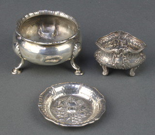 A Georgian silver salt on hoof feet, rubbed date letters, a Continental repousse bowl and ditto dish 