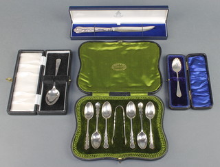 A cased set of Edwardian silver teaspoons and nips London 1910, 2 silver teaspoons and a ditto handled cheese knife, gross 114 grams 