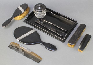 A silver mounted ebony dressing table set