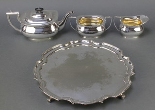 A silver plated 3 piece tea set and a ditto salver