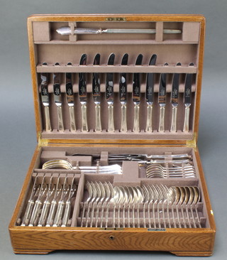 An oak canteen containing a quantity of plated Mappin & Webb tableware for 6 