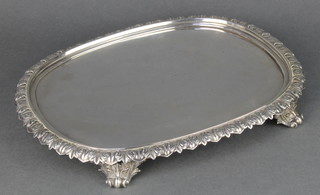 A William IV silver oval stand with acanthus decoration with a later silver insert and a wooden base 12" x 10" 