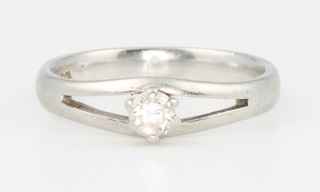 A platinum and diamond single stone ring with open shank size J 