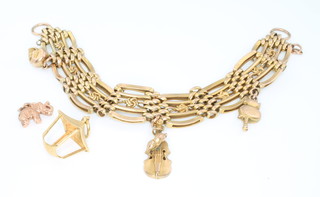 A 9ct yellow gold bracelet with charms, 20 grams 