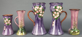 A pair of Torquay jugs, the purple ground with floral decoration 10", do. A Present from Margate 7" and 2 vases with floral decoration 6" and 7 1/2" 