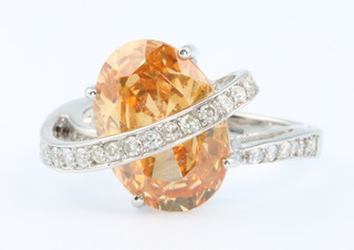 An 18ct yellow gold orange cubic zirconia and diamond ring, diamonds approx. 0.4ct size 0 1/2