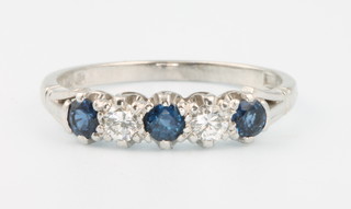 An 18ct white gold sapphire and diamond ring size Q
