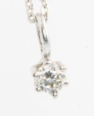 A 9ct white gold diamond pendant approx 0.2ct hung on an 18ct white gold chain 