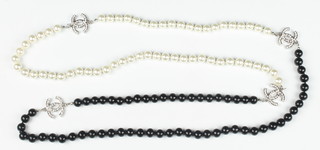 A string of black and white beads set with rhinestones 