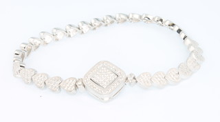 A cubic zirconia and silver heart link line bracelet