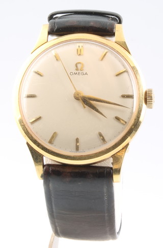 A gentleman's 9ct yellow gold Omega wristwatch on a leather strap 