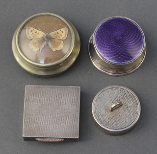 A circular silver engine turned pill box with folding handle, London 1958 by Asprey & Co 1 1/2" and 3 other boxes 