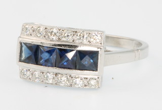 An 18ct white gold sapphire and diamond ring with 4 princess cut sapphires flanked by brilliant cut diamonds, size M  